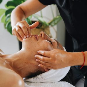 Enjoy a calming facial massage promoting wellness and relaxation at a luxurious spa.